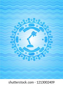 desk lamp icon inside water concept style badge.