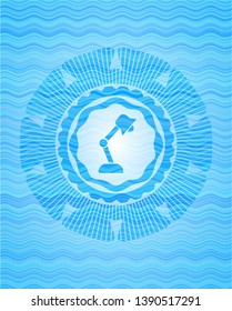 desk lamp icon inside water badge.