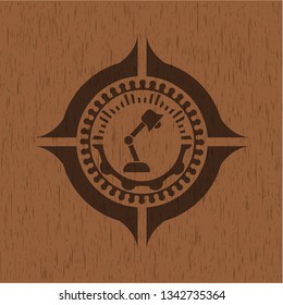 desk lamp icon inside wooden emblem. Vintage.