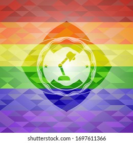 desk lamp icon on mosaic background with the colors of the LGBT flag