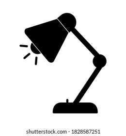 Desk lamp icon in trendy silhouette style design. Vector illustration isolated on white background.