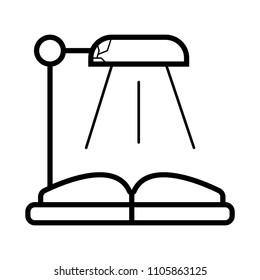  desk lamp and an open book.