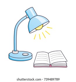 Desk lamp and an open book