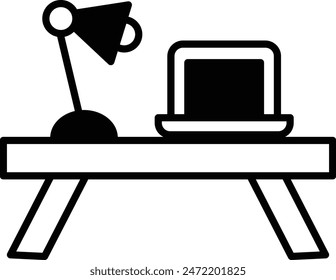A desk with a laptop and a lamp