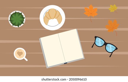 Desktop. Book reading. Reading a book at the table. Autumn atmosphere