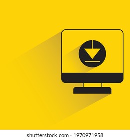 desktop computer and download with shadow yellow background