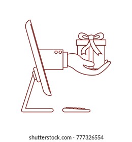 desktop computer and hand holding gift box of purchase online in dark red contour