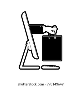 desktop computer and hand holding shopping bag of purchase online in black silhouette