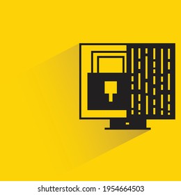 desktop computer and key with shadow on yellow background