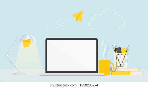 Desktop with computer, lamp, stationery and flying paper airplane.