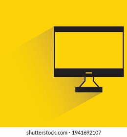 desktop computer with shadow on yellow background