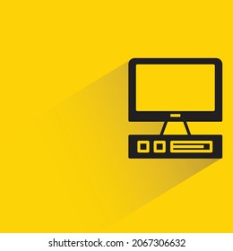 desktop computer with shadow on yellow background