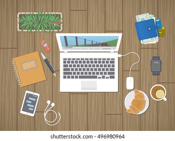 Desktop with laptop running the media player, personals, phone with messages, smart watch, headphones, notepad, tea, croissant. Relaxation, worktop, break, viewing film, play the game Top view Vector
