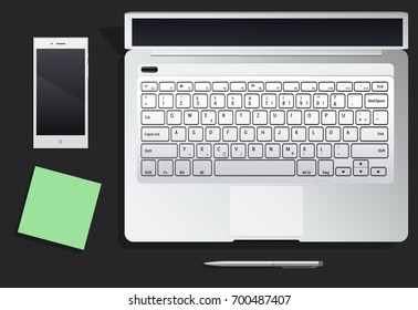desktop with phone and the laptop