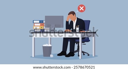 Desperate stressed businessman sitting at the office desk and working alone: business failure and burnout concept