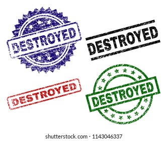 DESTROYED seal prints with distress surface. Black, green,red,blue vector rubber prints of DESTROYED title with unclean surface. Rubber seals with circle, rectangle, rosette shapes.