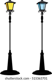 Detached two tall black street lamps are lit in blue and yellow isolated on a white background. 