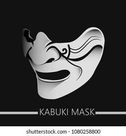 A detailed detailing of the white kabuki mask on a dark background