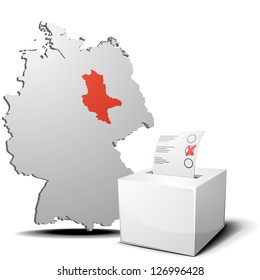 detailed illustration of ballot box in front of a 3D outline of Germany with a red marked province Saxony-Anhalt, eps 10