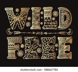 Detailed ornamental golden "Wild and Free Spirit" quote design.Isolated on black background.Boho chic style typographic elements for prints on t-shirts and bags or poster.Vector