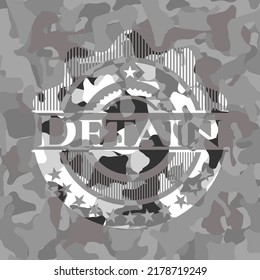 Detain written on a grey camouflage texture 