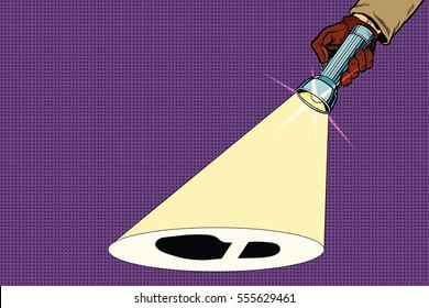 Detective flashlight beam shines on trail shoes. Pop art retro vector illustration