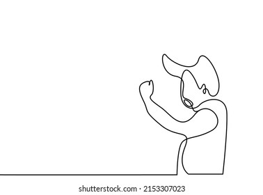 determined ambitious boy wins and clasps his arms and shouts overjoyed