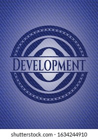 Development badge with jean texture. Vector Illustration. Detailed.