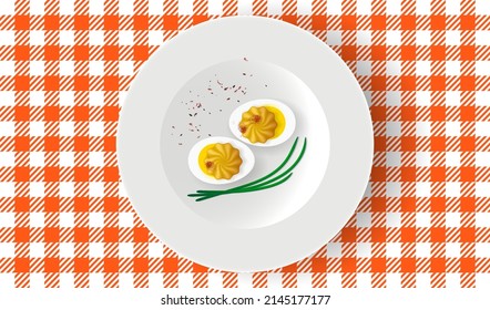 Deviled eggs with mayonnaise and paprika on white plate. Breakfast table, top view