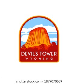 Devils Tower with retro designs and badges