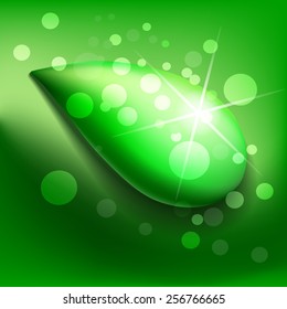 Dew drop with sparkle and bubbles on green background.
