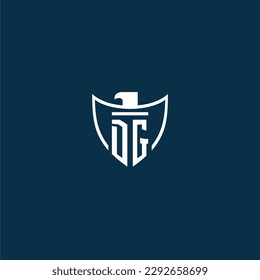 DG initial monogram logo for shield with eagle image vector design