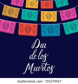 Dia de Los Muertos, Mexican Day of the Dead card, invitation. Party decoration, string of lights, handmade cut paper flags, skull, floral decor. Old wooden background.