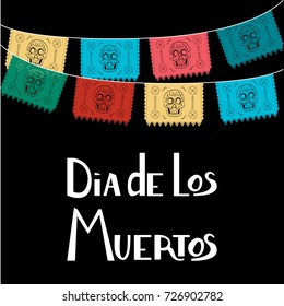 Dia de Los Muertos, Mexican Day of the Dead card, invitation. Party decoration, string of lights, handmade cut paper flags, skull, floral decor. Old wooden background.