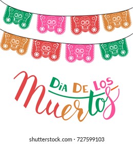 Dia de Los Muertos, Mexican Day of the Dead card, invitation. Party decoration, string of lights, handmade cut paper flags, skull, floral decor. Old wooden background.