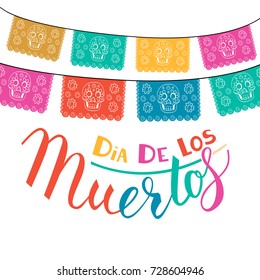 Dia de Los Muertos, Mexican Day of the Dead card, invitation. Party decoration, string of lights, handmade cut paper flags, skull, floral decor. Old wooden background.