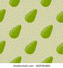 Diagonal avocado ornament simple seamless pattern. Light pastel background with dots. Fruit simple backdrop. Designed for wallpaper, textile, wrapping paper, fabric print. Vector illustration.