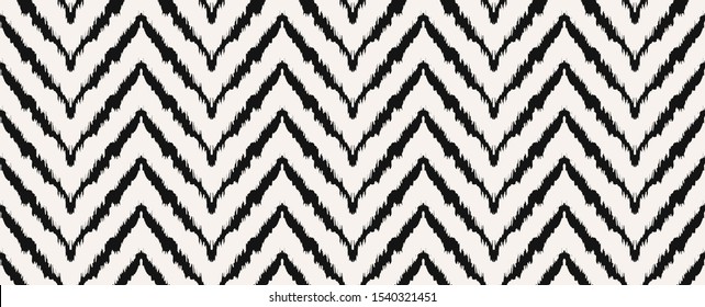 Diagonal ikat stripes. Zigzag pattern seamless. Geometric chevron abstract illustration, wallpaper. Tribal ethnic vector texture. Aztec style. Folk embroidery. Indian, Scandinavian,  African rug.