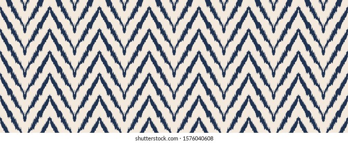 Diagonal ikat stripes. Zigzag pattern seamless. Geometric chevron abstract illustration, wallpaper. Tribal ethnic vector texture. Aztec style. Folk embroidery. Indian, Scandinavian,  African rug.