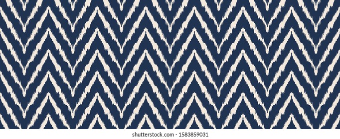 Diagonal ikat stripes. Zigzag pattern seamless. Geometric chevron abstract illustration, wallpaper. Tribal ethnic vector texture. Aztec style. Folk embroidery. Indian, Scandinavian,  African rug.