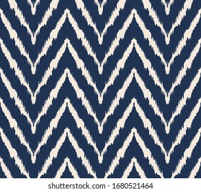 Diagonal ikat stripes. Zigzag pattern seamless. Geometric chevron abstract illustration, wallpaper. Tribal ethnic vector texture. Aztec style. Folk embroidery. Indian, Scandinavian,  African rug.