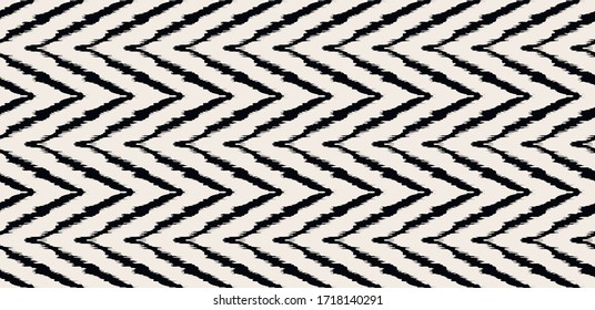 Diagonal ikat stripes. Zigzag pattern seamless. Geometric chevron abstract illustration, wallpaper. Tribal ethnic vector texture. Aztec style. Folk embroidery. Indian, Scandinavian,  African rug.