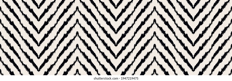 Diagonal ikat stripes. Zigzag pattern seamless. Geometric chevron abstract illustration, wallpaper. Tribal ethnic vector texture. Aztec style. Folk embroidery. Indian, Scandinavian,  African rug.