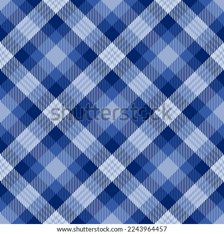 Diagonal indigo plaid. Seamless vector tartan pattern suitable for fashion, home decor and stationary
