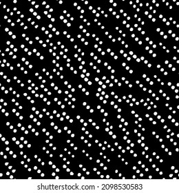 Diagonal rows of small dots seamless repeat pattern. Vector, irregular spots all over surface print in black and white.