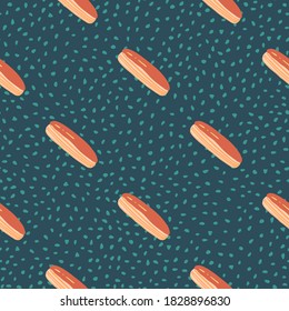 Diagonal tasty eclair seamless food pattern. Sweet elements in orange tones on dark turquoise dotted background. Decorative backdrop for fabric design, textile, wrapping, cover. Vector illustration.