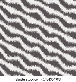 Diagonal wavy chevron zig zag lines.  Soft, blurry, ikat design.  Seamless repeat vector pattern swatch.