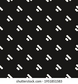 Diagonal white caterpillars pattern. Black background.