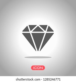 Diamond or brilliant, icon of wealth. Icon under spotlight. Gray background