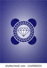 diamond icon inside badge with denim background